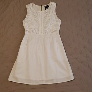 Sleeveless white cotton dress, eyelet detailed top